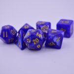 purple dices with different geometrical shape on a white surface